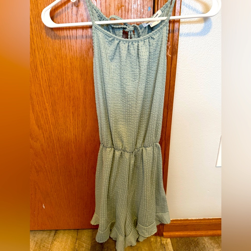 Caution to the Wind SM light green romper, skinny strap, ruffle bottom, tie